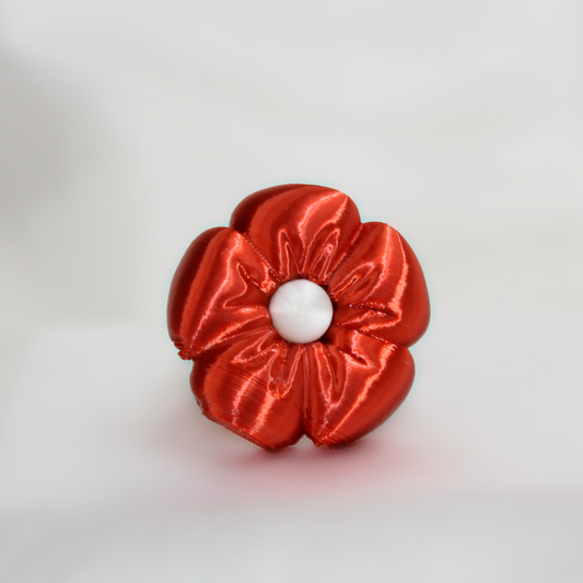 Red scrunchie on a white background